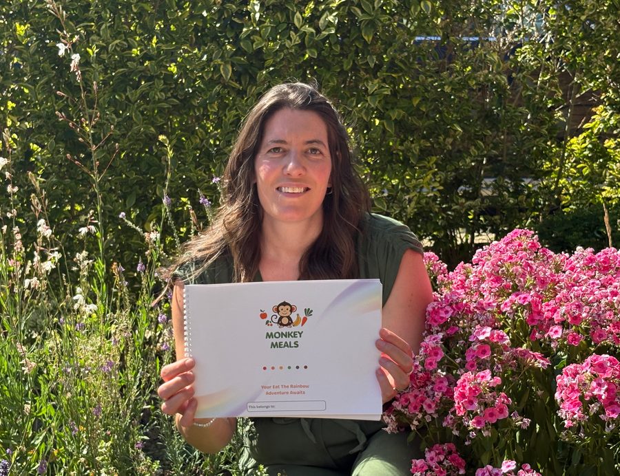 Catriona, who started Monkey Meals Club, holding the planner in her garden.